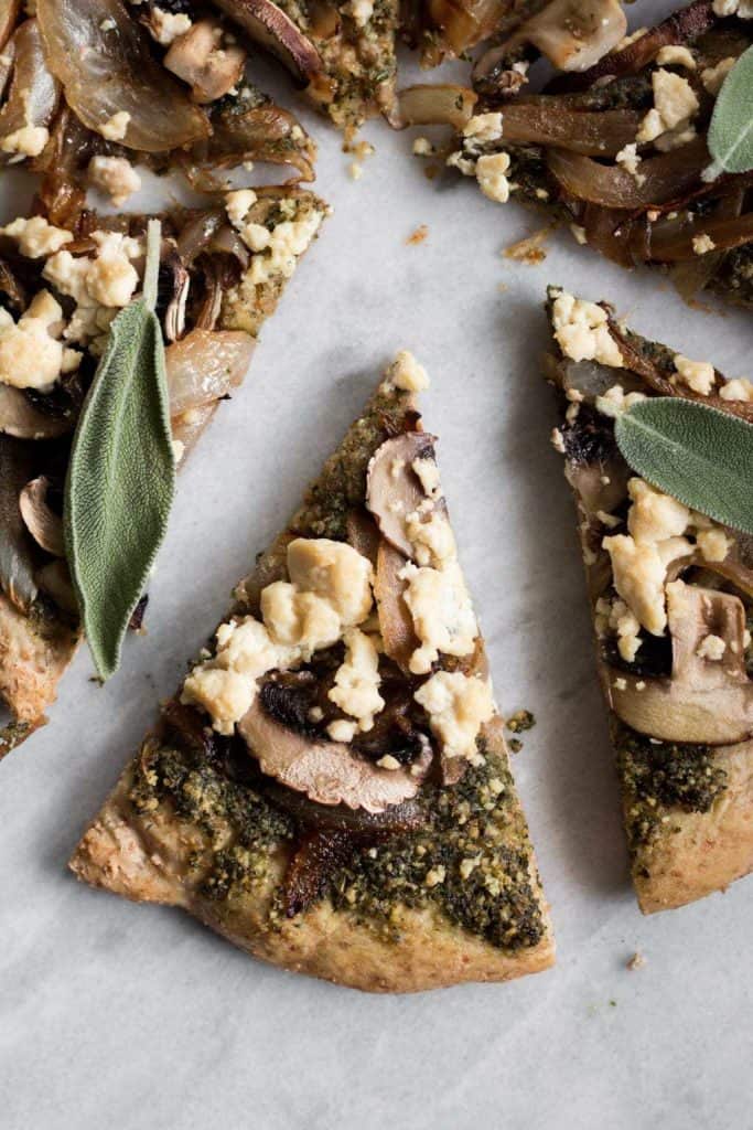 slice of pizza with sage pesto