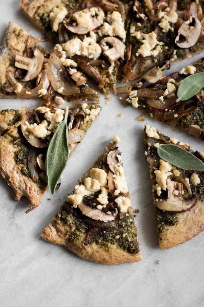slice of pizza with sage pesto