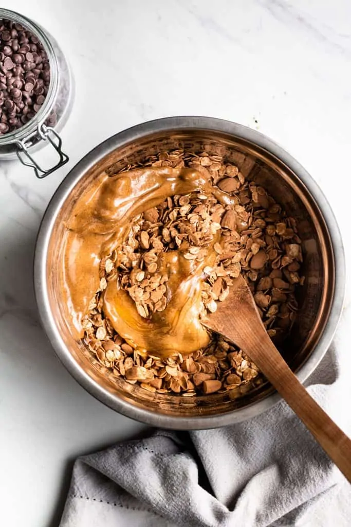 granola ingredients combined in a bowl