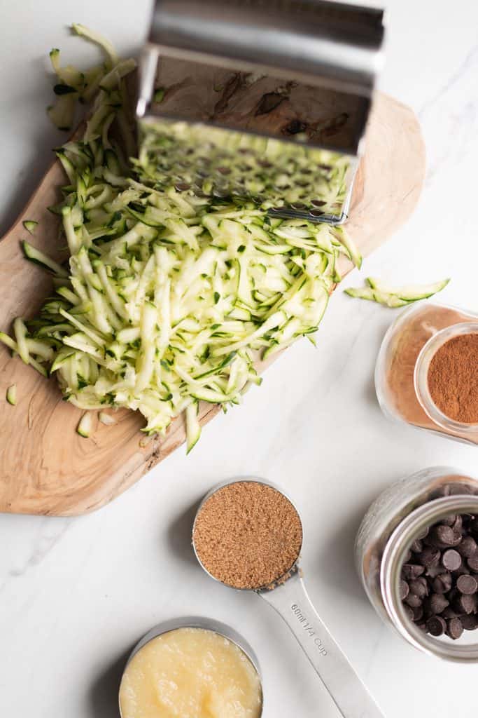 shredded zucchini, grater, sugar, cinnamon, applesauce and chocolate from the top