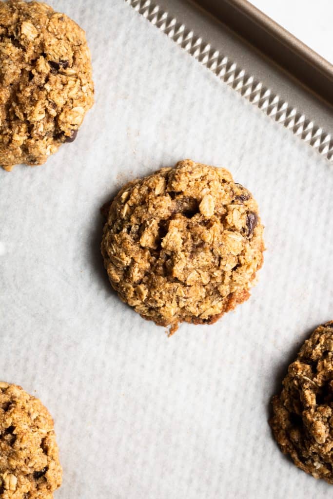 baked pumpkin chocolate chip cookies on a baking sheet