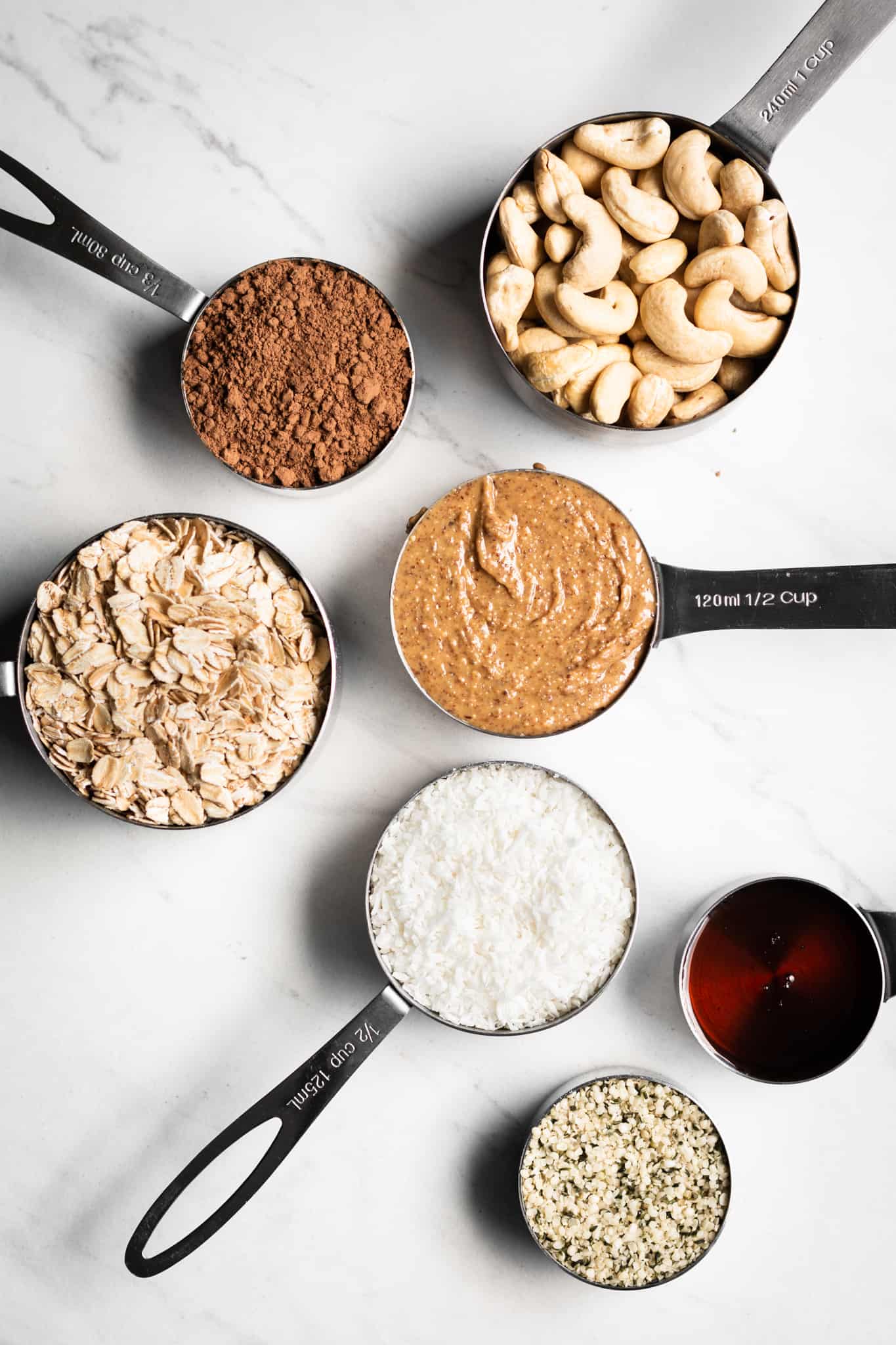 granola ingredients in measuring cups