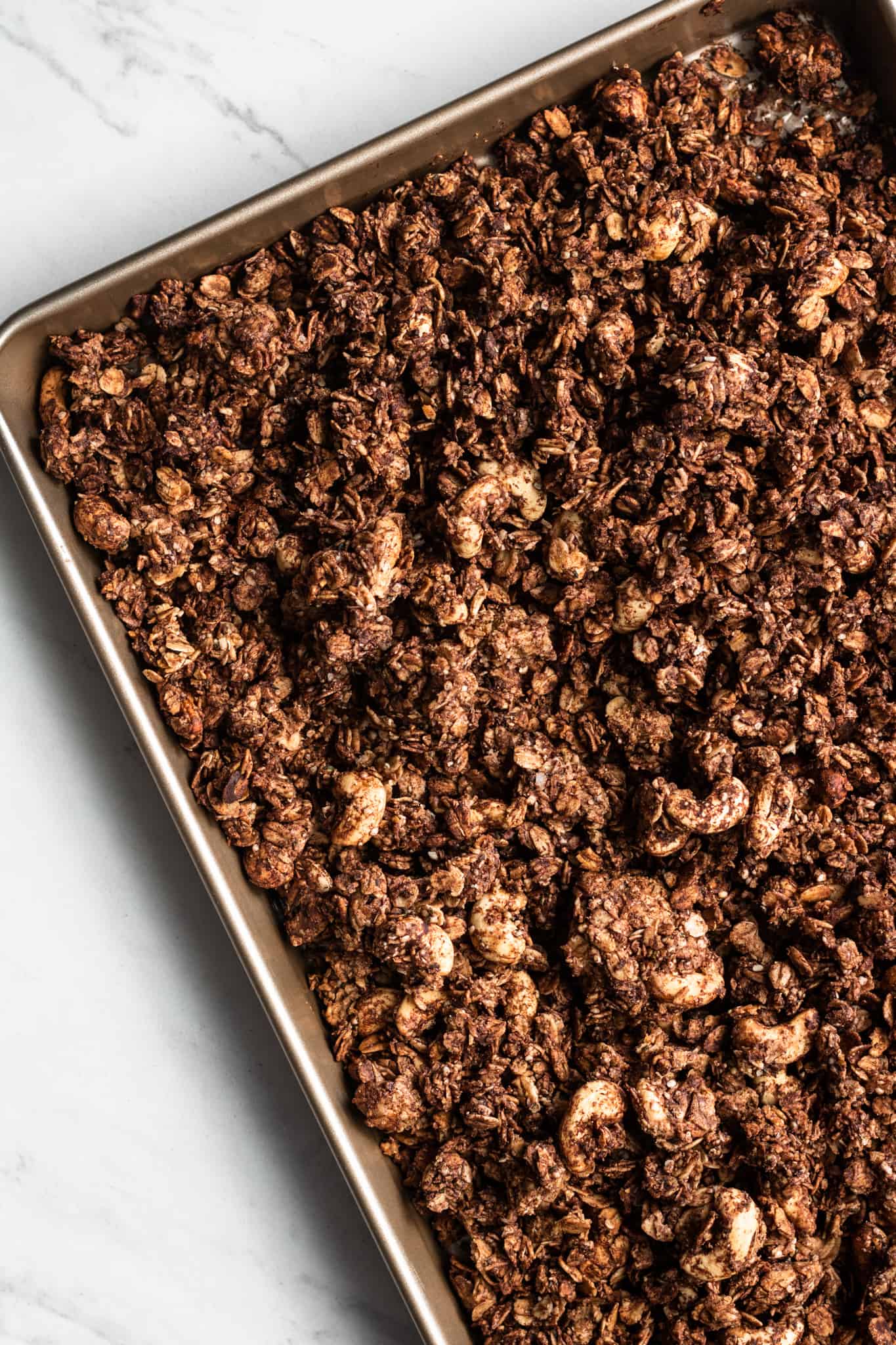 baked granola on a baking sheet
